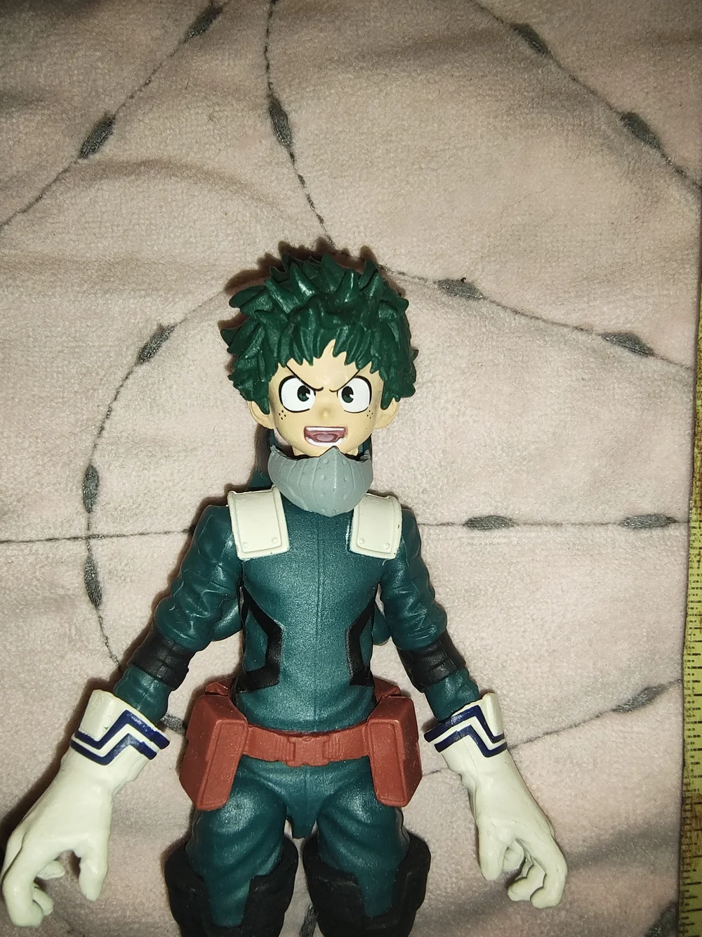 Green and Red Superhero Action Figure with White Gloves